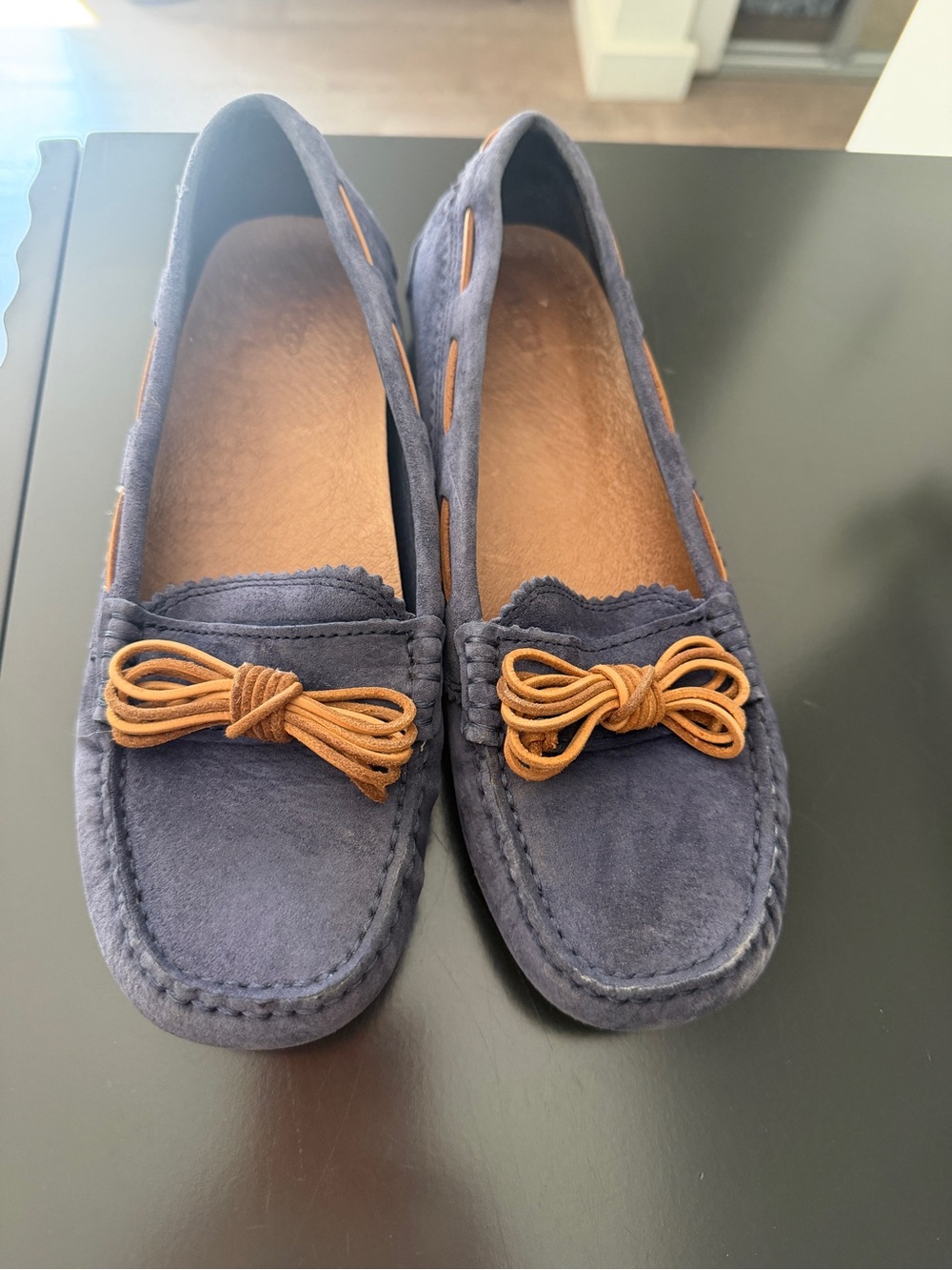 UGG Navy Suede Moccasins with Tan Bow